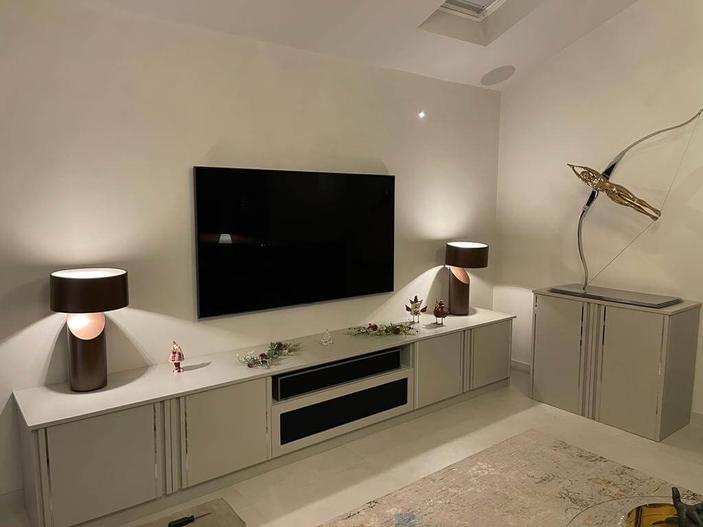 Media Unit housing devices, with touch open cabinets and matching display stand