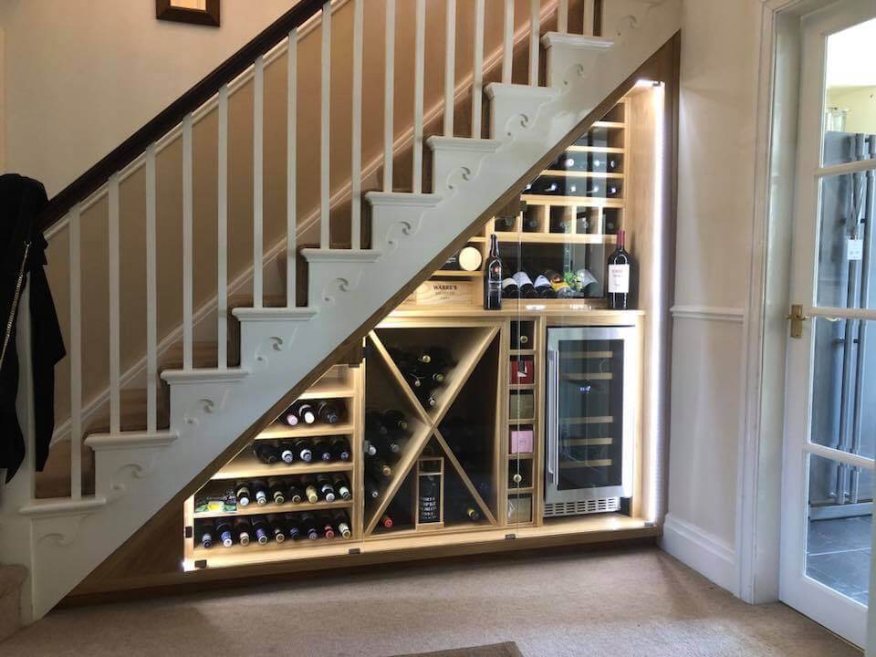 Under Stairs Storage for wine with racks and refrigerator